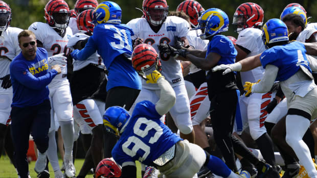 Rams defensive tackle Aaron Donald is knocked to the ground as a third scuffle escalates into a brawl at Rams-Bengals joint practice.